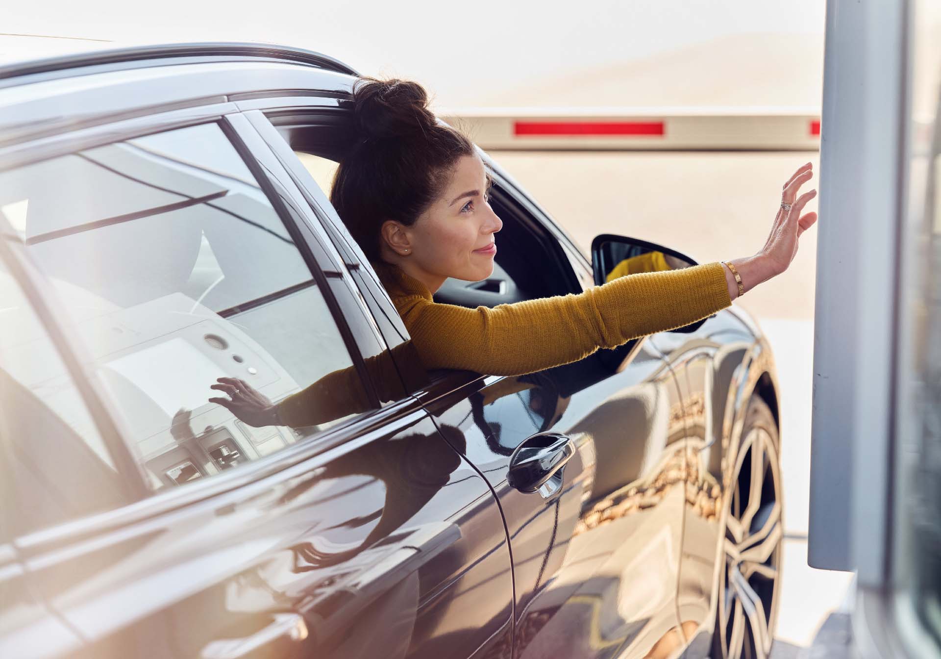 Woman in car Checking in at a Scandlines harbour in blue lane