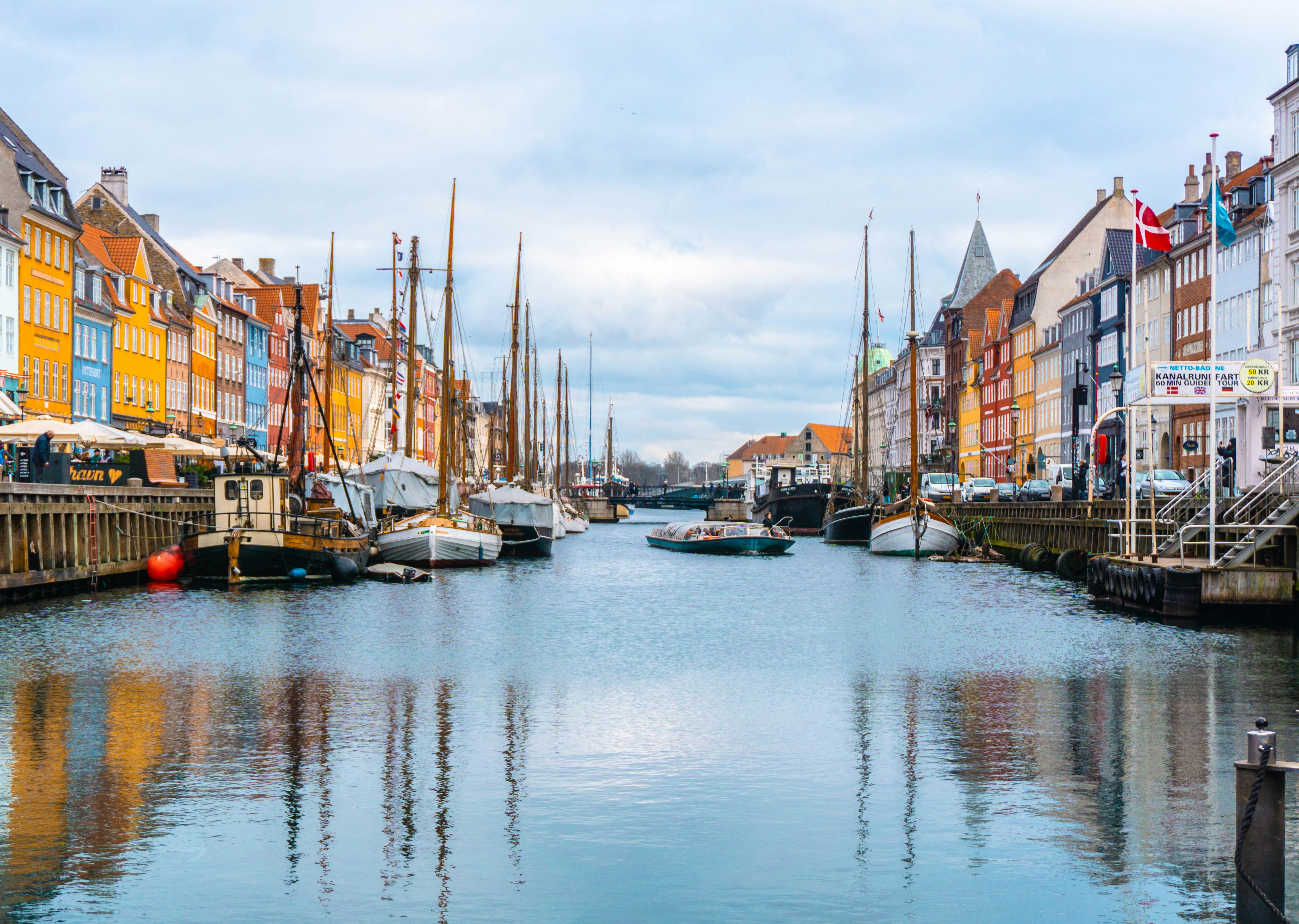 Boatson blue Water in front of blue Sky in Copenhagen Nyhavn Denmark 