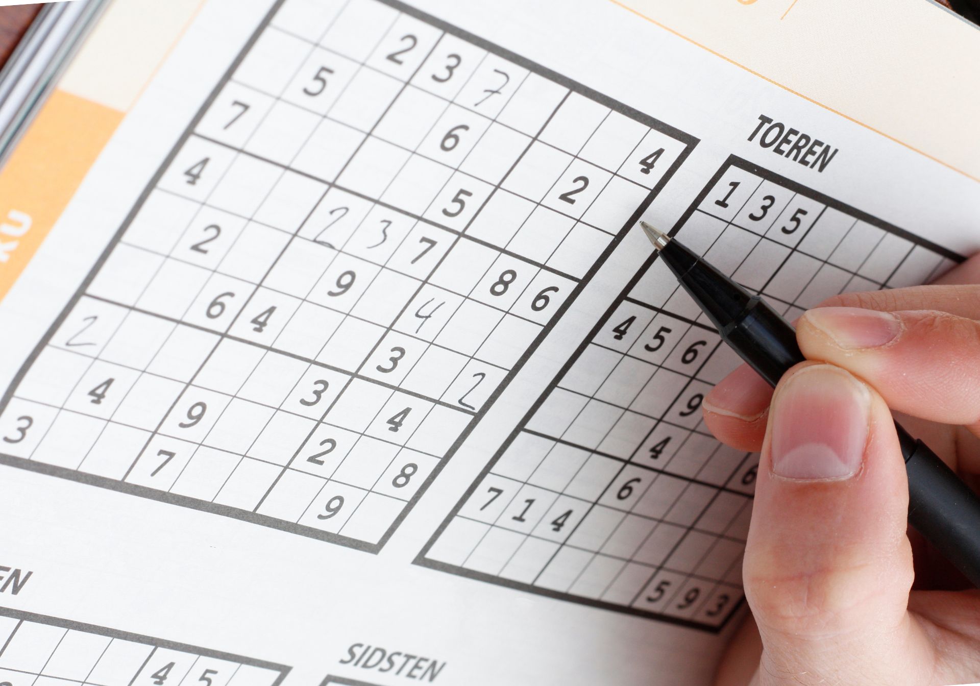 Person doing sudoku