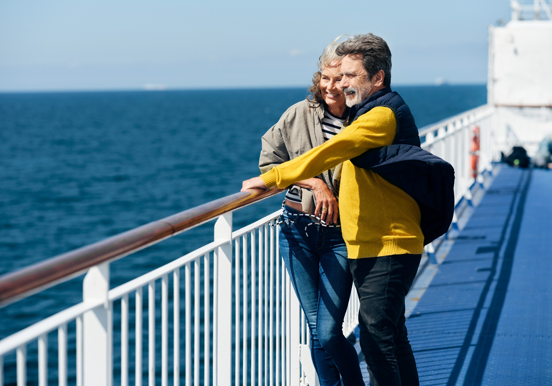 Couple Standing Together On The Deck